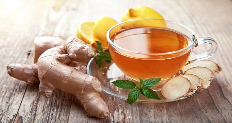 Your Natural Health - A cup of ginger tea with fresh ginger slices and a cozy background.