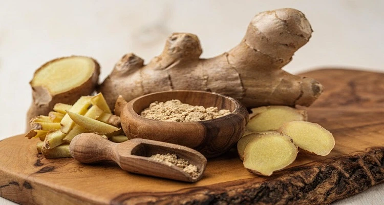 Your Natural Health - An image of fresh ginger roots with a note on side effects and precautions.